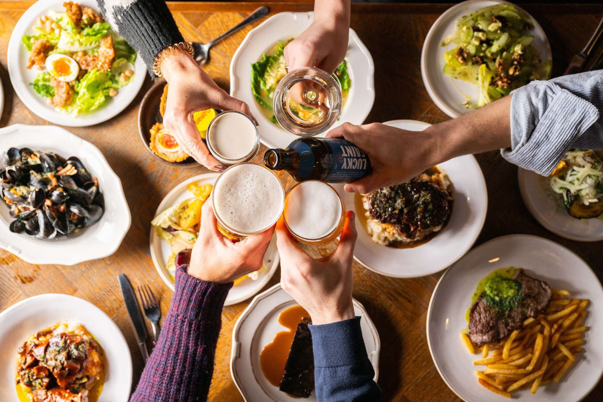 Birds eye view of Food gathering & cheers with friends and family