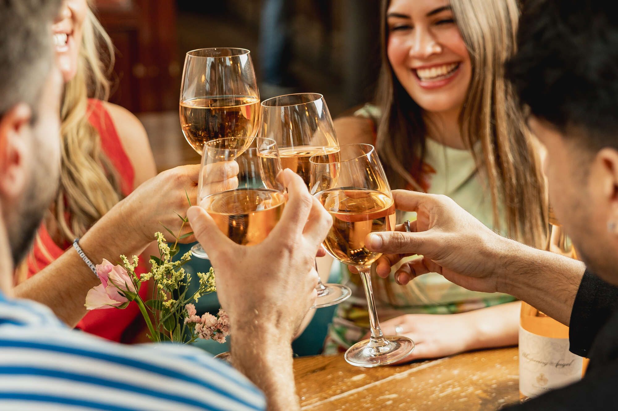 Cheers with glasses of Rose