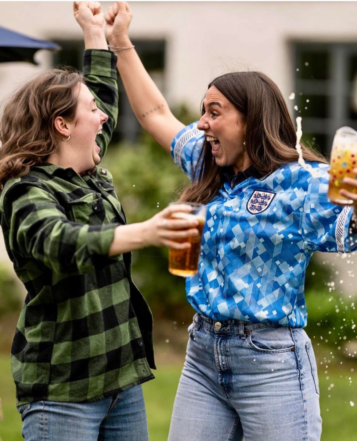 FIFA World cup 2026 - 2 ladies celebrating and cheering with pints of beer