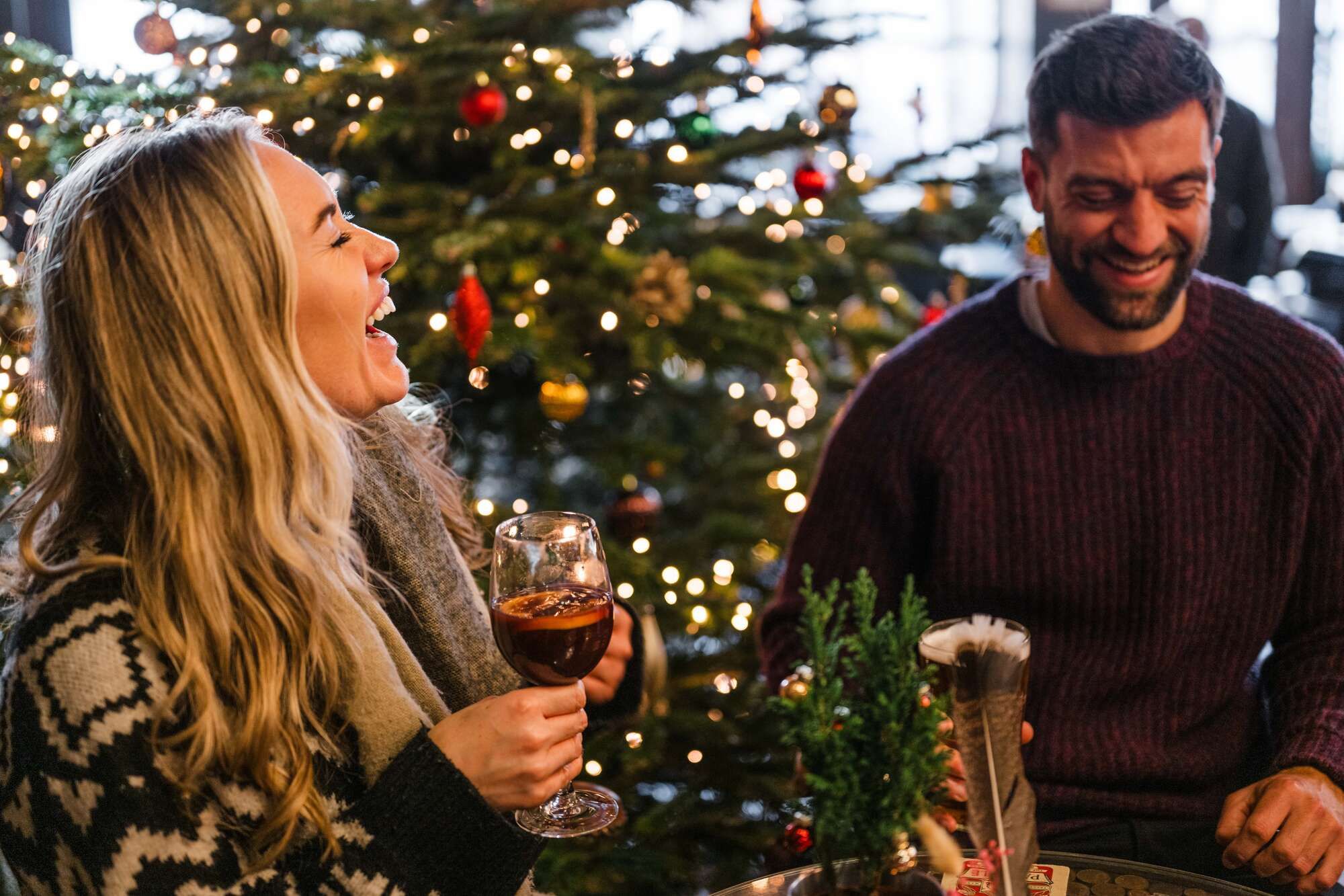 Mulled wine and beer laughing around the Christmas tree