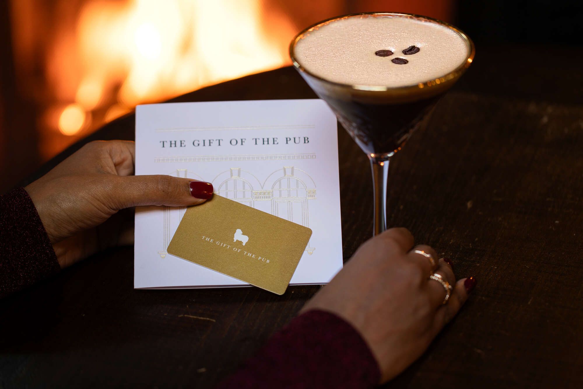 gift card with an espresso martini by the fireplace